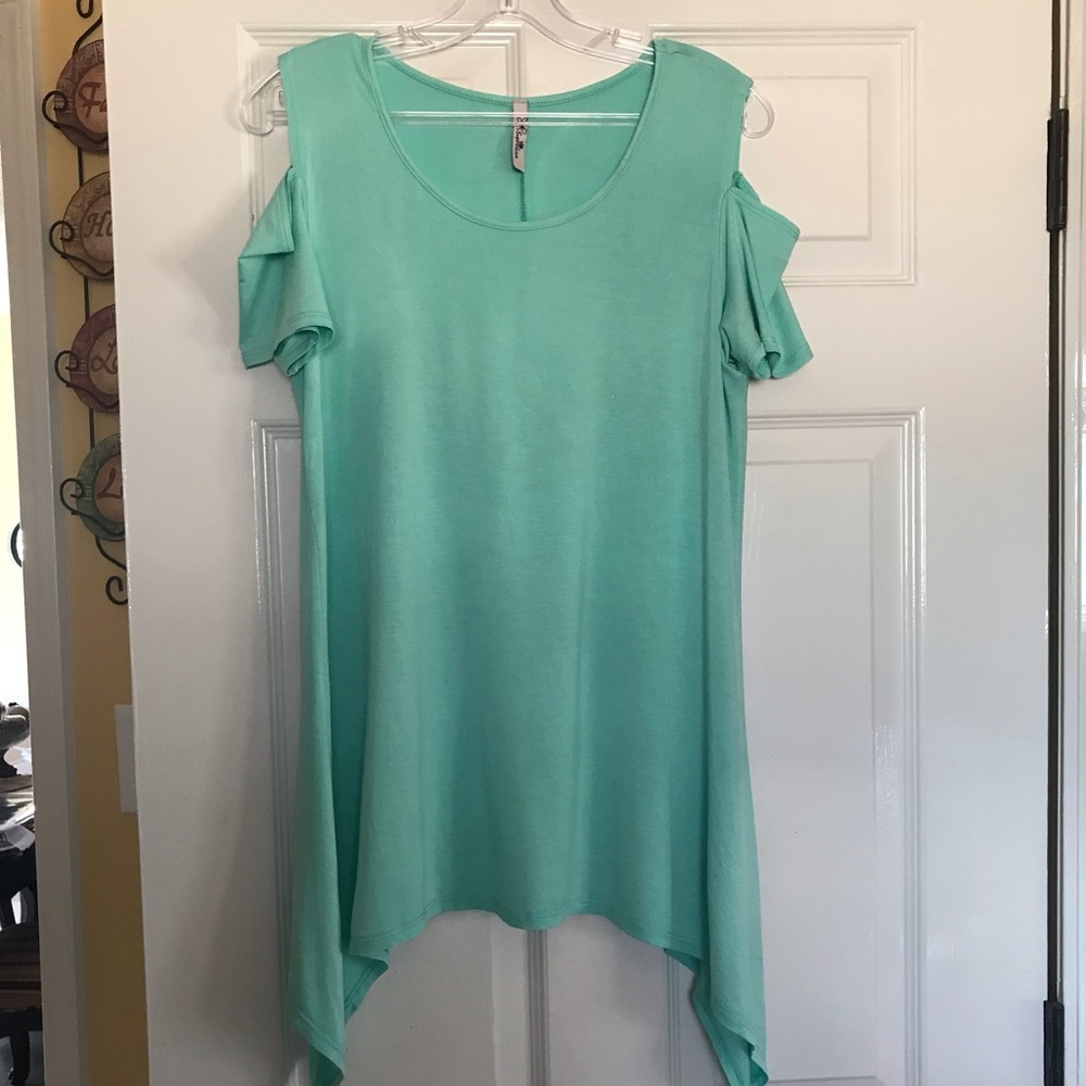 Cold shoulder, shark bite tunic.  Size Medium